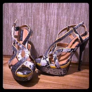 Yellow snake skin pumps